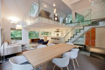 Glass surrounds the hanging loft