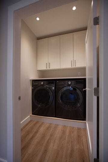 Laundry room with storage cabinets