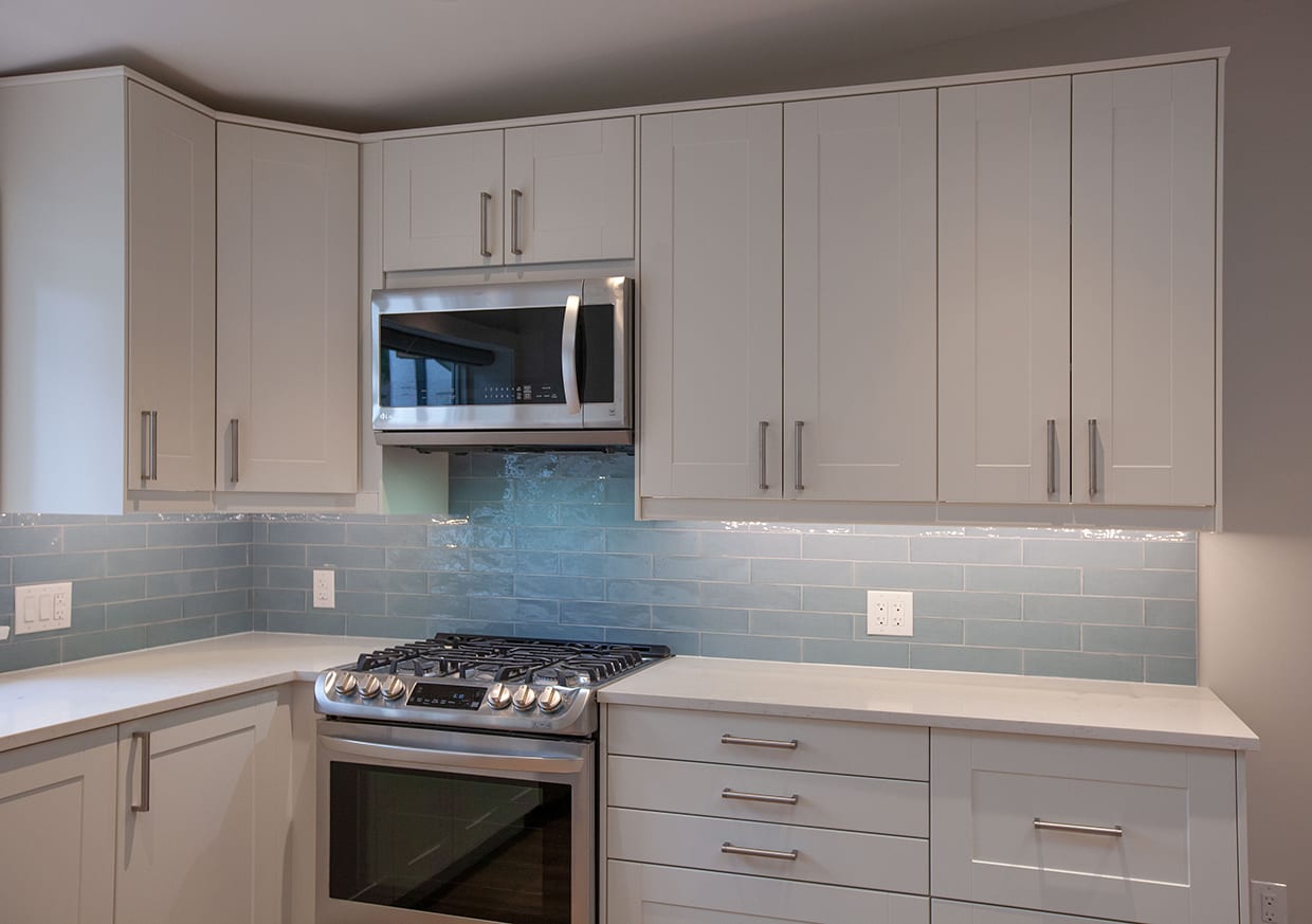 kitchen with close up of stove and microwave