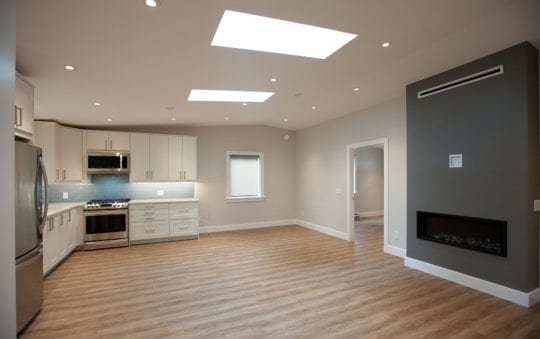 Great room with kitchen, dining and living area.