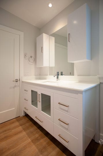 Bathroom vanity with mirror and wall hung cabinets