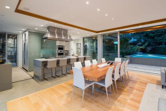 Custom-built kitchen with wooden table in North Vancouver.