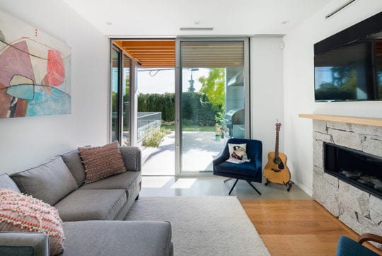 Custom build main floor den with sliding door access to BBQ area.