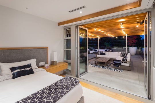 Custom built master bedroom with a direct view of the rooftop patio.