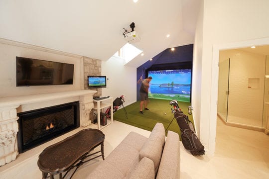 Pool House featuring a golf simulation area with a projector and simulated indoor grass.