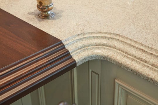 Luxury, custom kitchen countertop with granite and walnut.