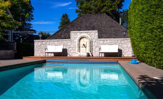 The wide shot of the pool and cabana